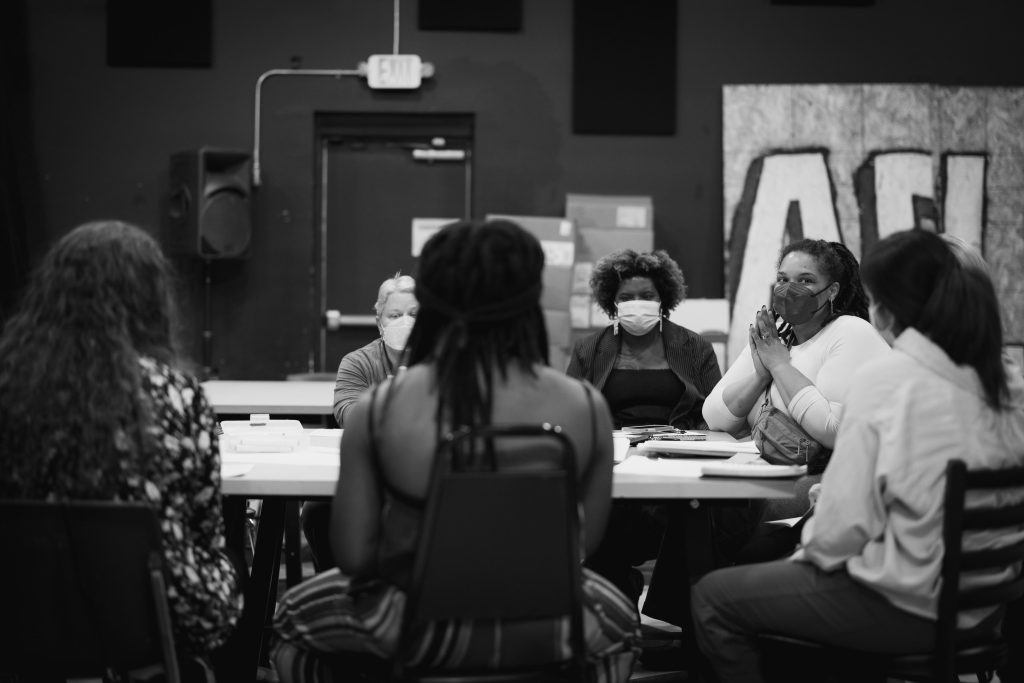 Community members building connections during group activities